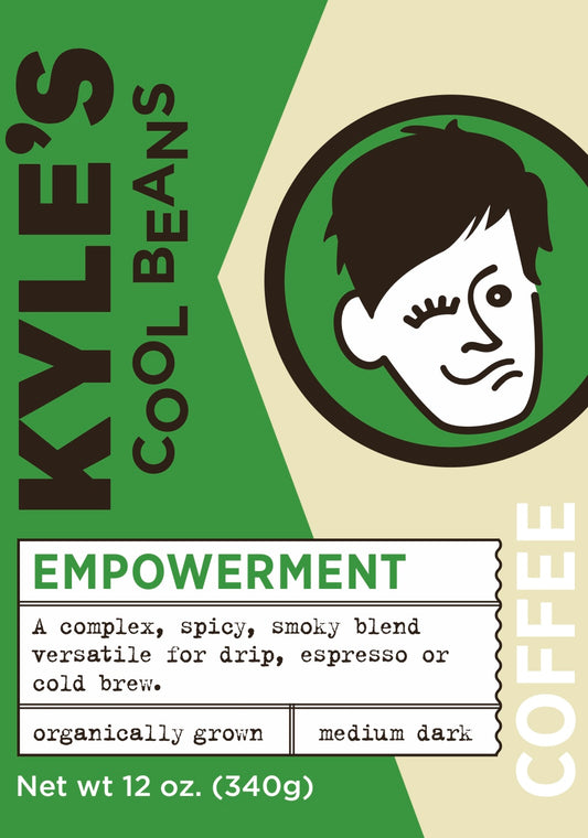 A picture of the Coffee Label. It says Empowerment; A complex, spicy, smoky blend. Versatile for drip, espresso or cold brew. Medium dark.